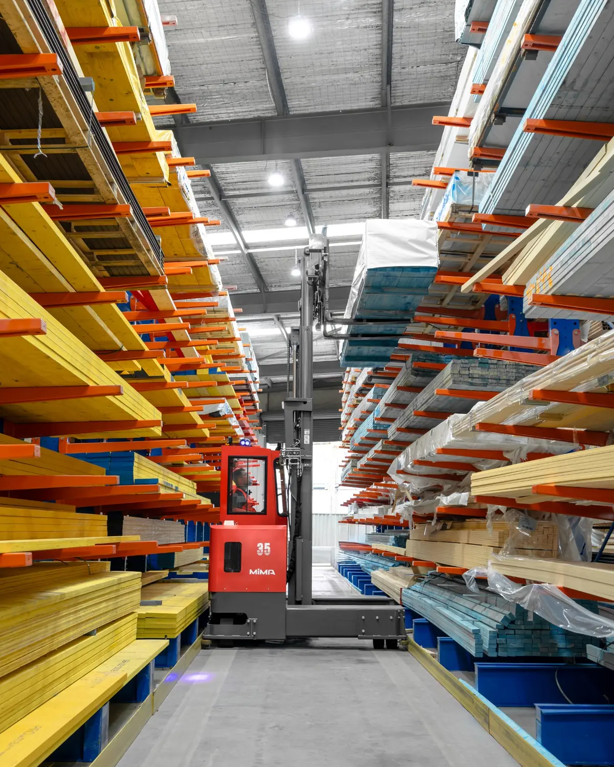MiMA multi-directional forklift handling long materials in a narrow aisle